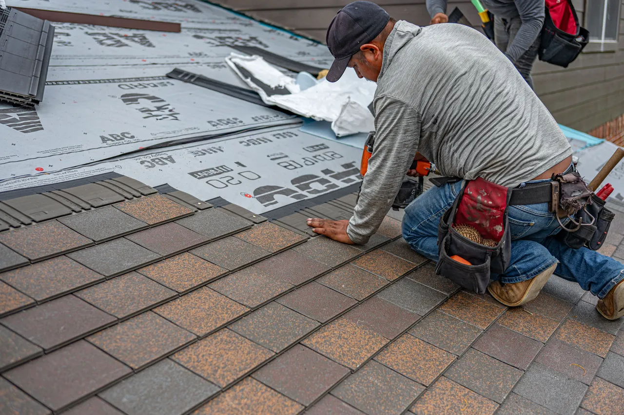 Hand-nailing shingles — Advantage Roofing